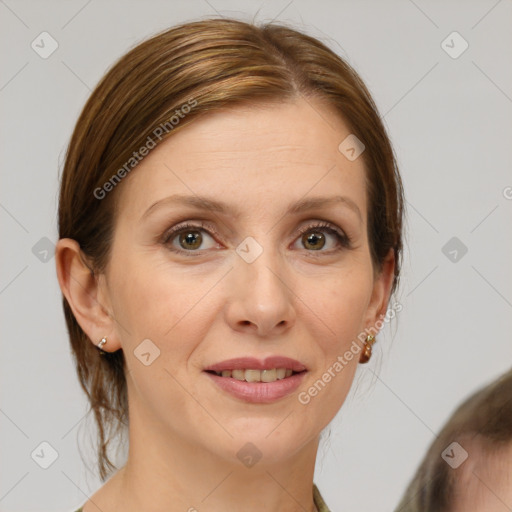 Joyful white adult female with medium  brown hair and grey eyes