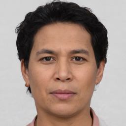 Joyful asian adult male with short  brown hair and brown eyes