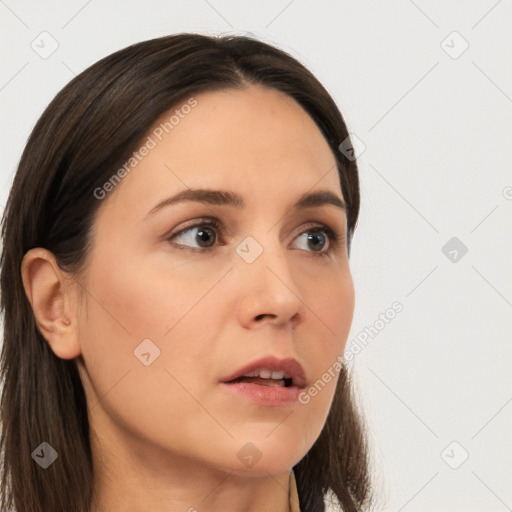 Neutral white young-adult female with long  brown hair and brown eyes