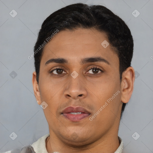 Neutral latino young-adult male with short  brown hair and brown eyes