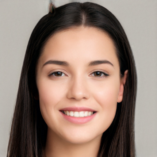 Joyful white young-adult female with long  black hair and brown eyes