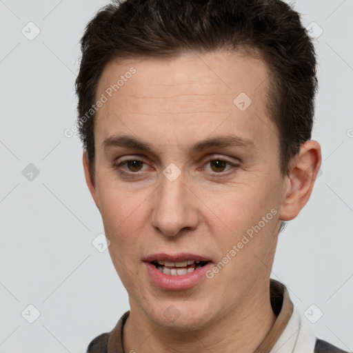 Joyful white adult male with short  brown hair and brown eyes