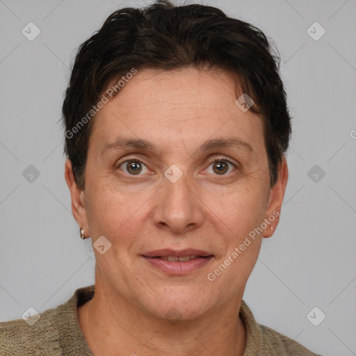 Joyful white adult female with short  brown hair and brown eyes