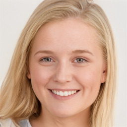 Joyful white young-adult female with long  brown hair and blue eyes