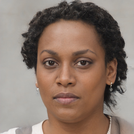 Neutral black young-adult female with short  brown hair and brown eyes