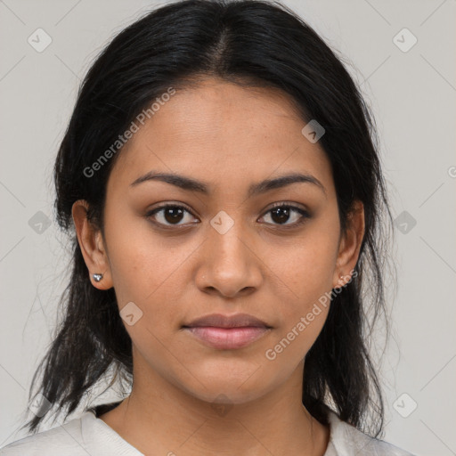 Joyful latino young-adult female with medium  brown hair and brown eyes