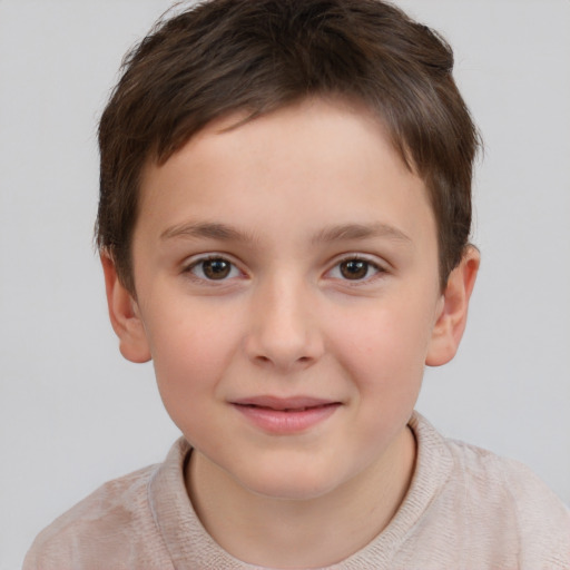 Joyful white child male with short  brown hair and brown eyes