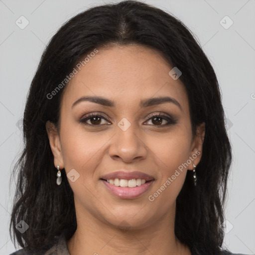 Joyful latino young-adult female with long  brown hair and brown eyes