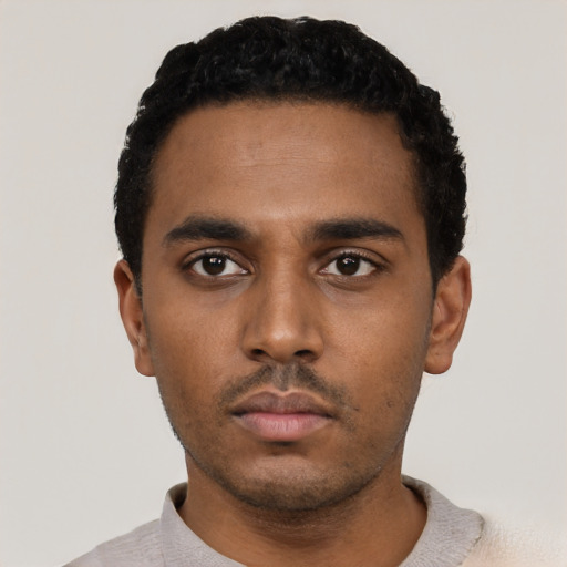 Neutral black young-adult male with short  black hair and brown eyes