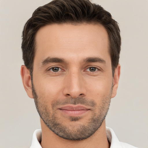 Joyful white young-adult male with short  brown hair and brown eyes