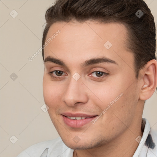 Joyful white young-adult male with short  brown hair and brown eyes