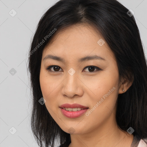 Joyful asian young-adult female with long  brown hair and brown eyes