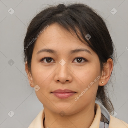 Joyful latino young-adult female with medium  brown hair and brown eyes