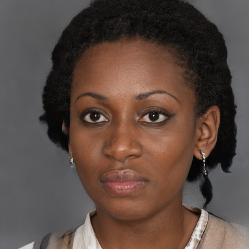 Neutral black young-adult female with short  black hair and brown eyes
