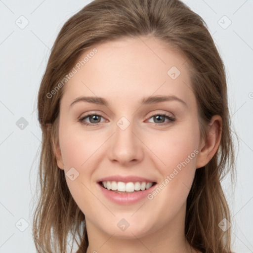 Joyful white young-adult female with long  brown hair and grey eyes