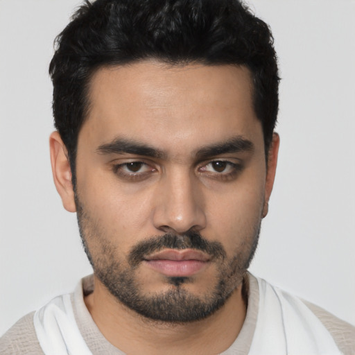 Neutral latino young-adult male with short  black hair and brown eyes