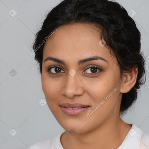 Joyful latino young-adult female with medium  brown hair and brown eyes