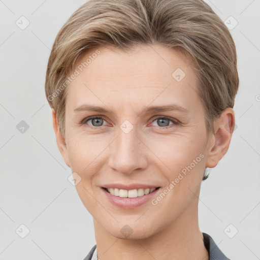 Joyful white young-adult female with short  brown hair and grey eyes