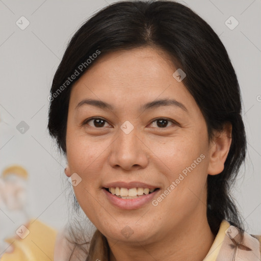 Joyful asian adult female with medium  brown hair and brown eyes