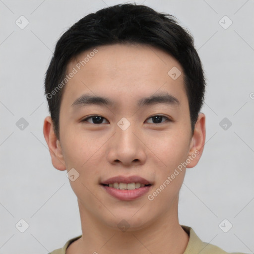 Joyful asian young-adult male with short  black hair and brown eyes