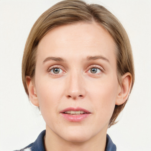 Joyful white young-adult female with medium  brown hair and blue eyes