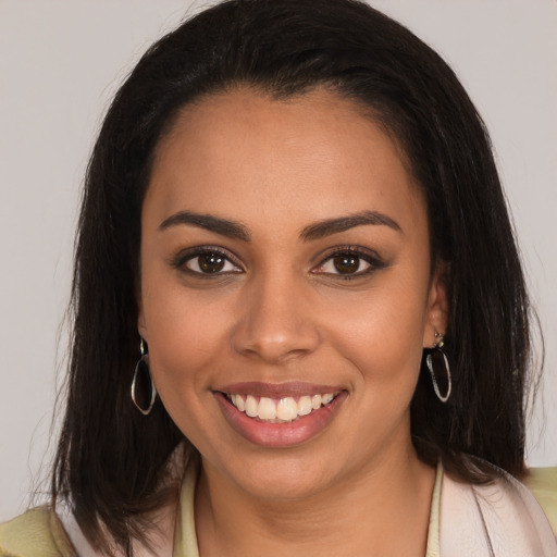 Joyful white young-adult female with medium  brown hair and brown eyes