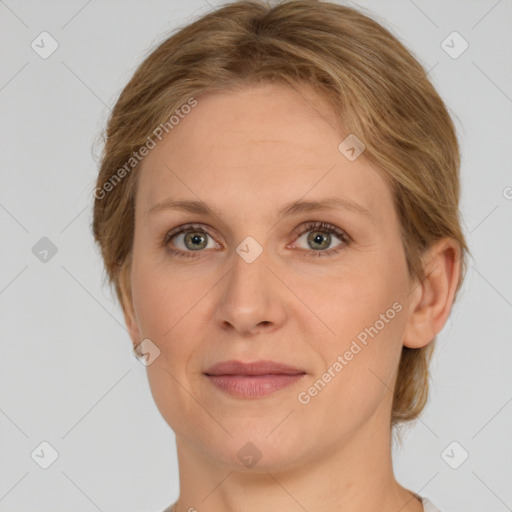 Joyful white young-adult female with medium  brown hair and green eyes