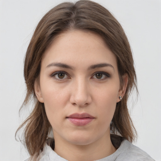 Neutral white young-adult female with medium  brown hair and brown eyes