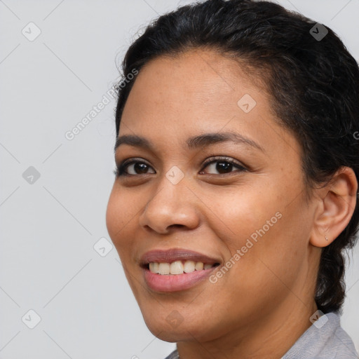 Joyful latino young-adult female with short  brown hair and brown eyes