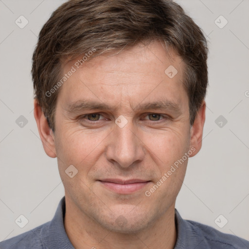 Joyful white adult male with short  brown hair and grey eyes