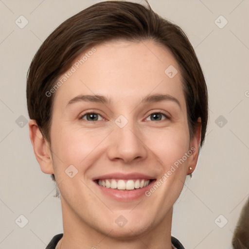 Joyful white young-adult female with short  brown hair and grey eyes