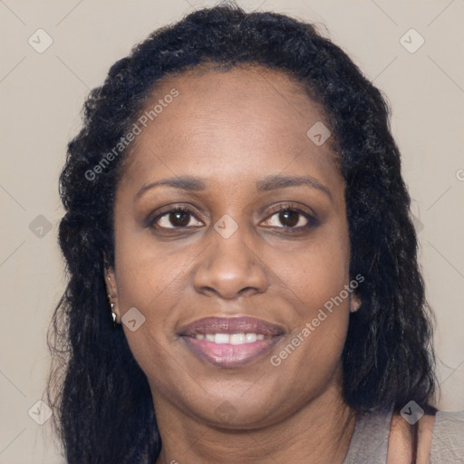 Joyful latino adult female with long  brown hair and brown eyes