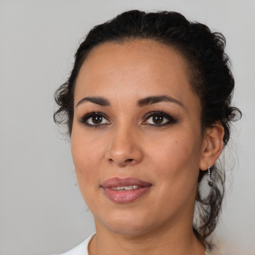 Joyful latino young-adult female with medium  black hair and brown eyes