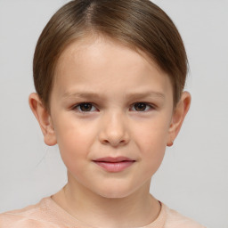 Joyful white child female with short  brown hair and brown eyes