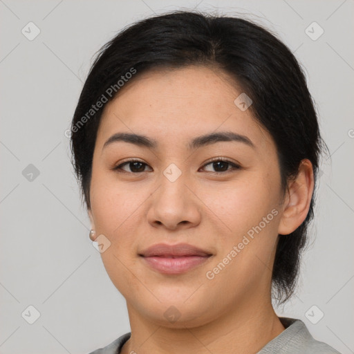 Joyful asian young-adult female with short  brown hair and brown eyes