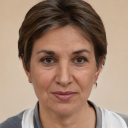 Joyful white adult female with short  brown hair and brown eyes