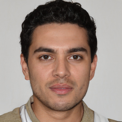 Neutral white young-adult male with short  black hair and brown eyes