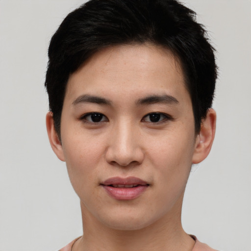 Joyful asian young-adult female with short  black hair and brown eyes
