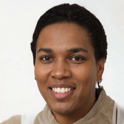 Joyful black young-adult female with short  black hair and brown eyes