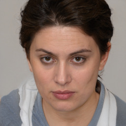 Neutral white young-adult female with medium  brown hair and brown eyes