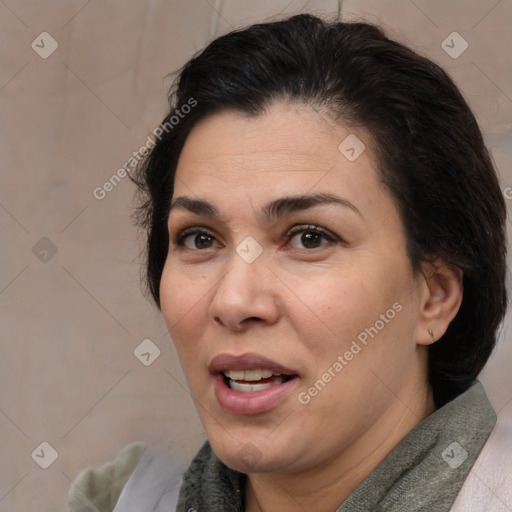 Joyful white adult female with medium  brown hair and brown eyes