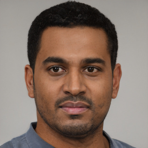 Neutral black young-adult male with short  black hair and brown eyes
