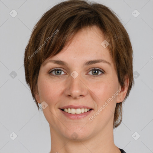 Joyful white young-adult female with medium  brown hair and green eyes