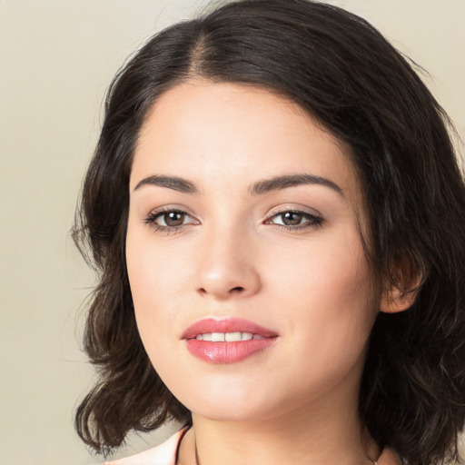 Joyful white young-adult female with medium  black hair and brown eyes