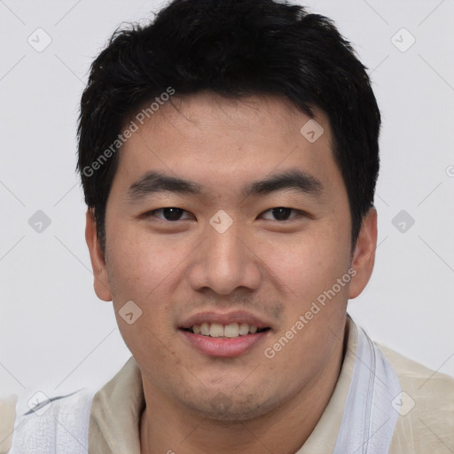 Joyful asian young-adult male with short  black hair and brown eyes