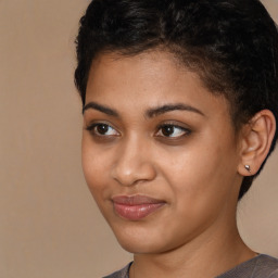 Joyful latino young-adult female with short  brown hair and brown eyes