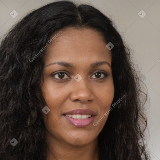 Joyful black young-adult female with long  brown hair and brown eyes