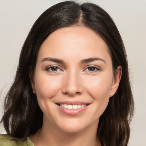 Joyful white young-adult female with medium  brown hair and brown eyes