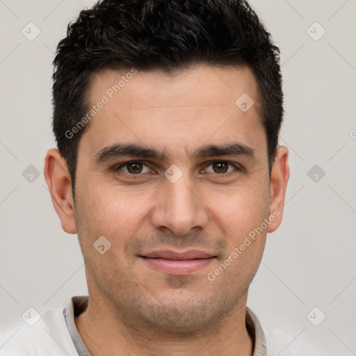 Joyful white young-adult male with short  brown hair and brown eyes