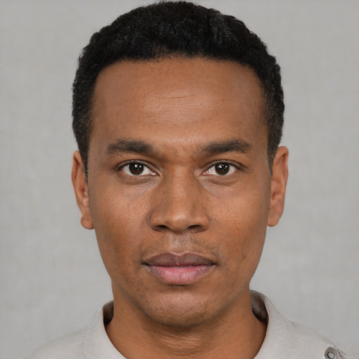 Neutral black young-adult male with short  black hair and brown eyes